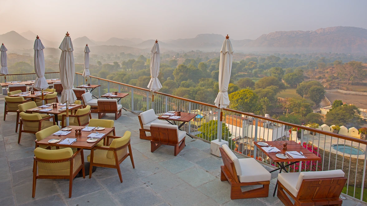 7b. restaurant (deck sitting area x view of the aravalis) - raas devigarh1729163177.webp