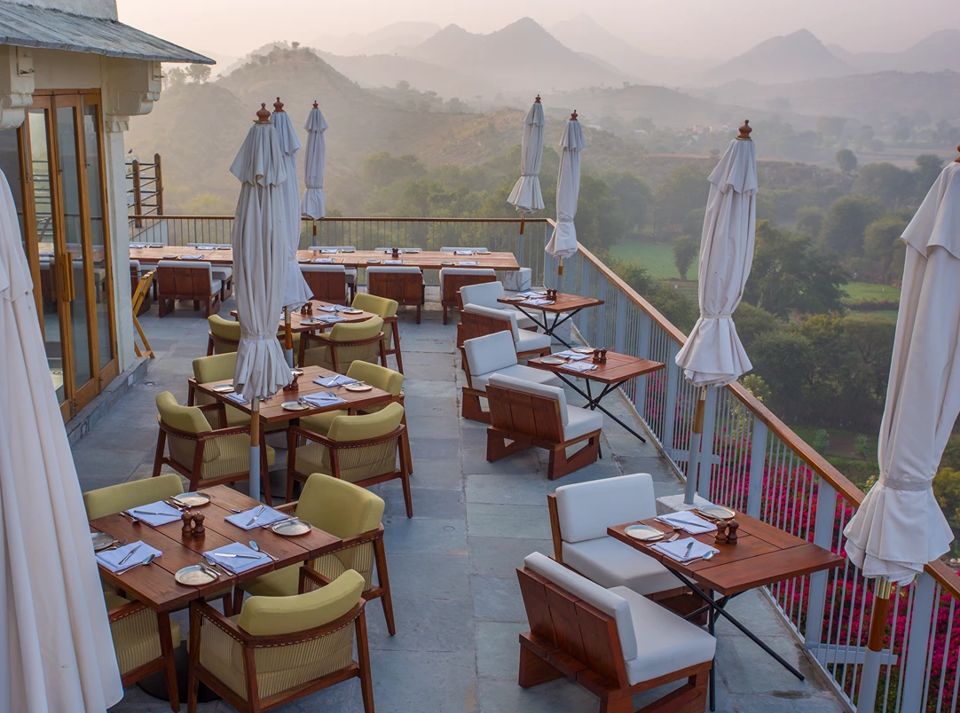 7c. restaurant (deck sitting area x view of the aravalis) - raas devigarh1729163177.webp