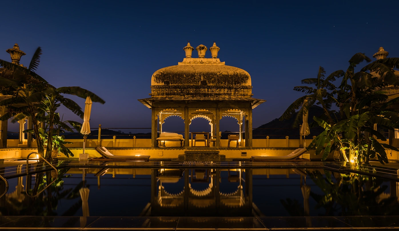 9c. devigarh suite (pool x outdoor sitting night view) - raas devigarh1729163177.webp